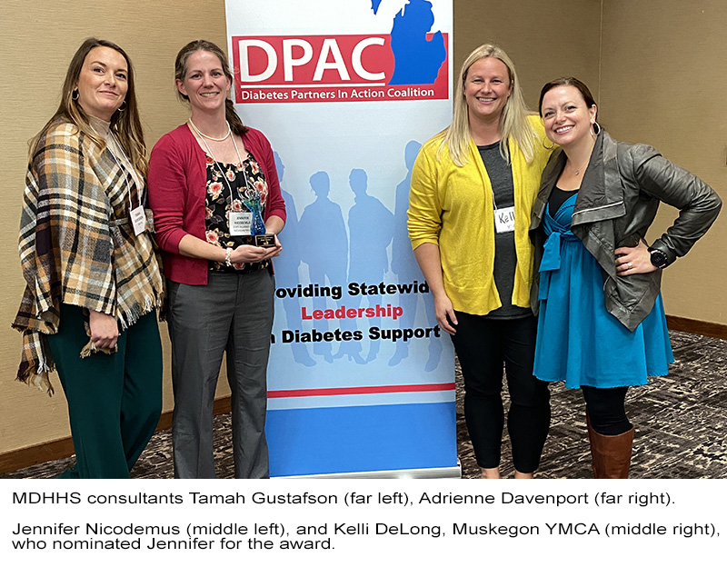 MDHHS consultants Tamah Gustafson (far left) and Adrienne Davenport (far right).  Jennifer Nicodemus (middle left) and Kelli DeLong (middle right), Muskegon YMCA, who nominated Jennifer for the award